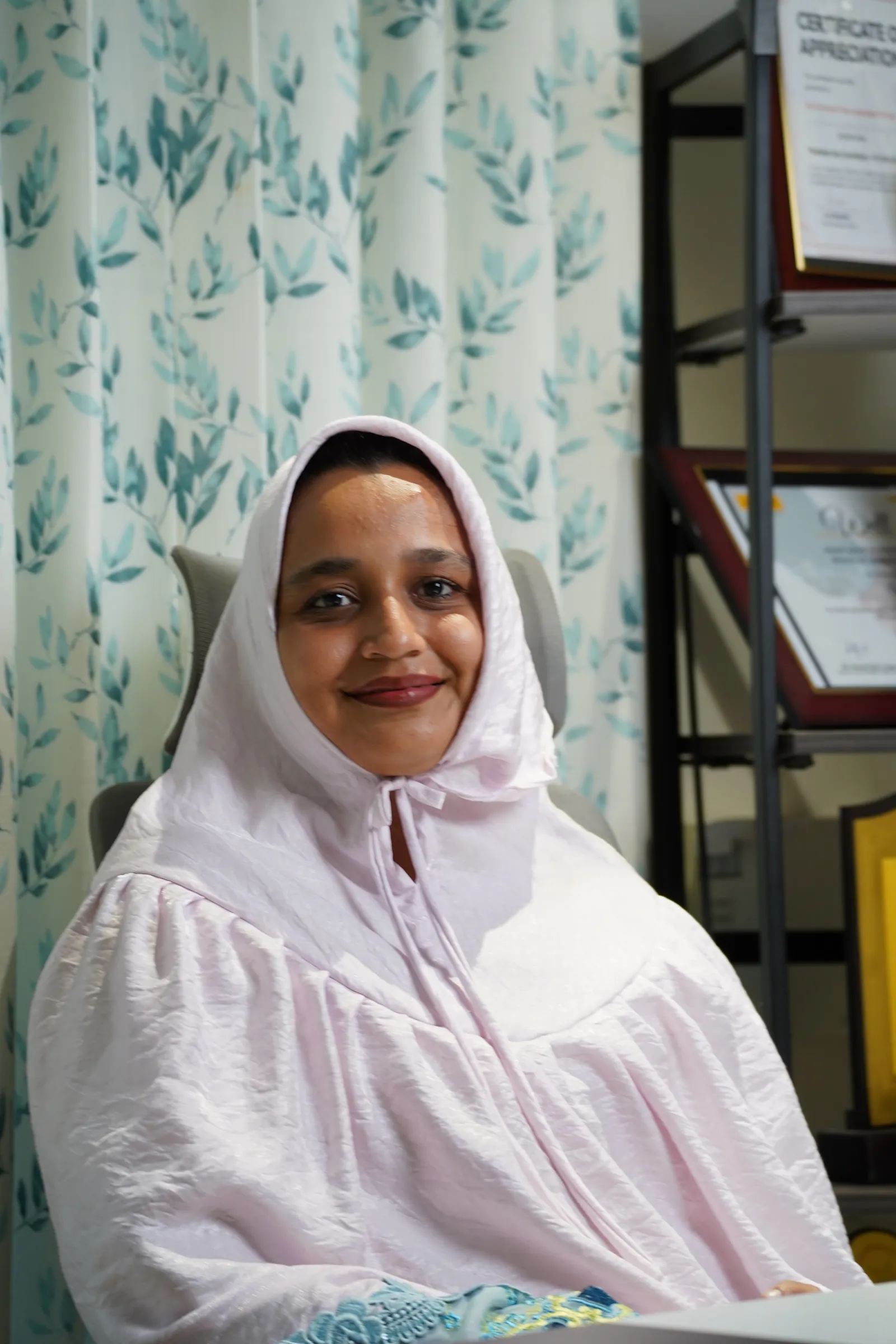 Alifiya at her desk in the Chennai office