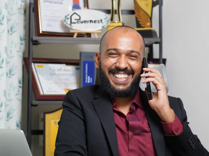 Silvah on a call at his desk