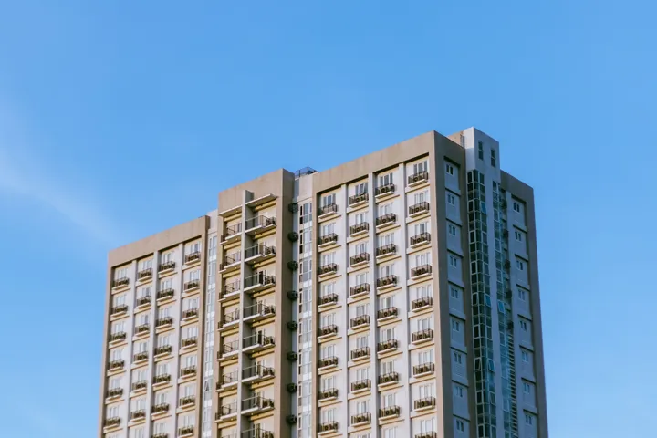 An apartment block against a blue sky